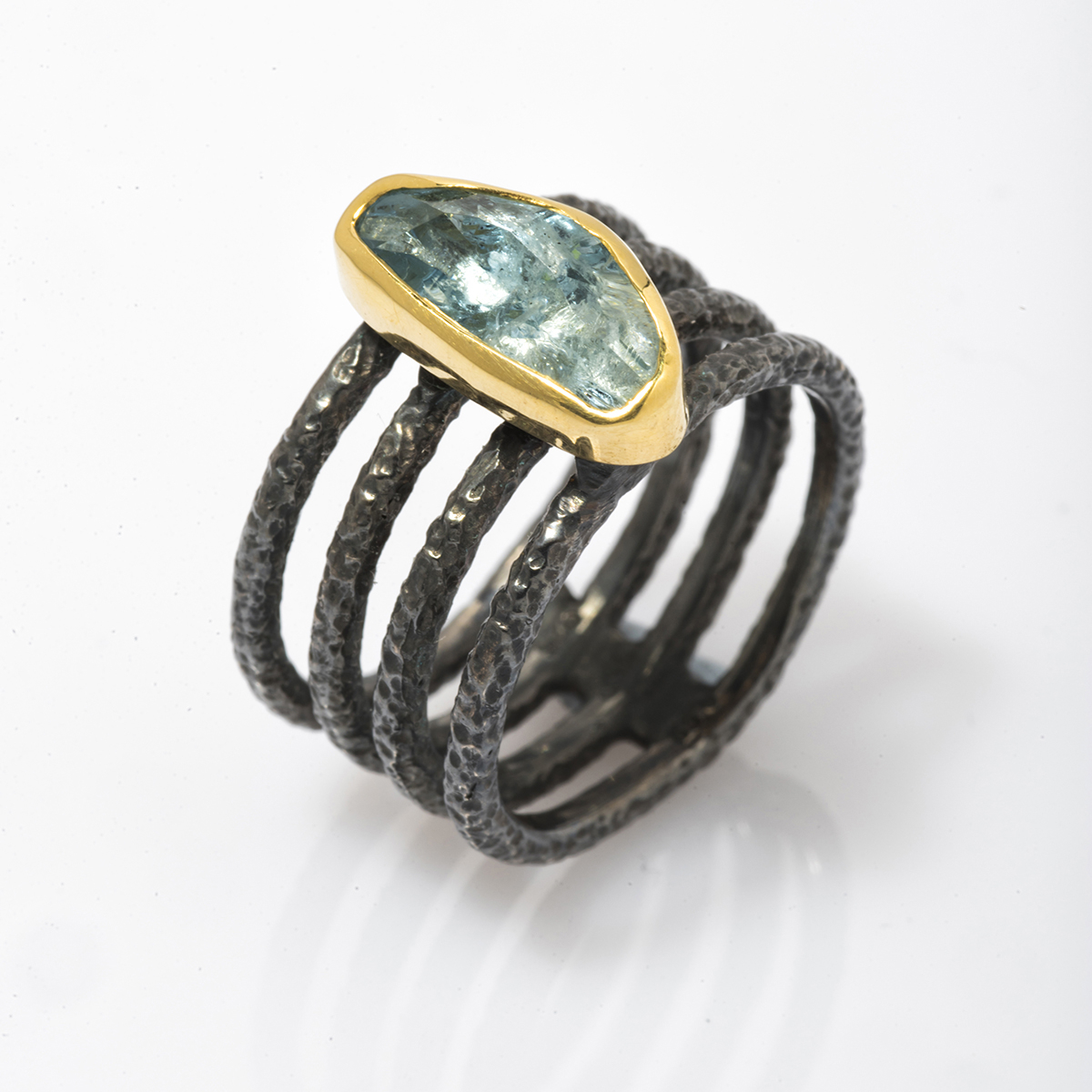 Aquamarine, Gold bezel & four oxidized Silver band ring