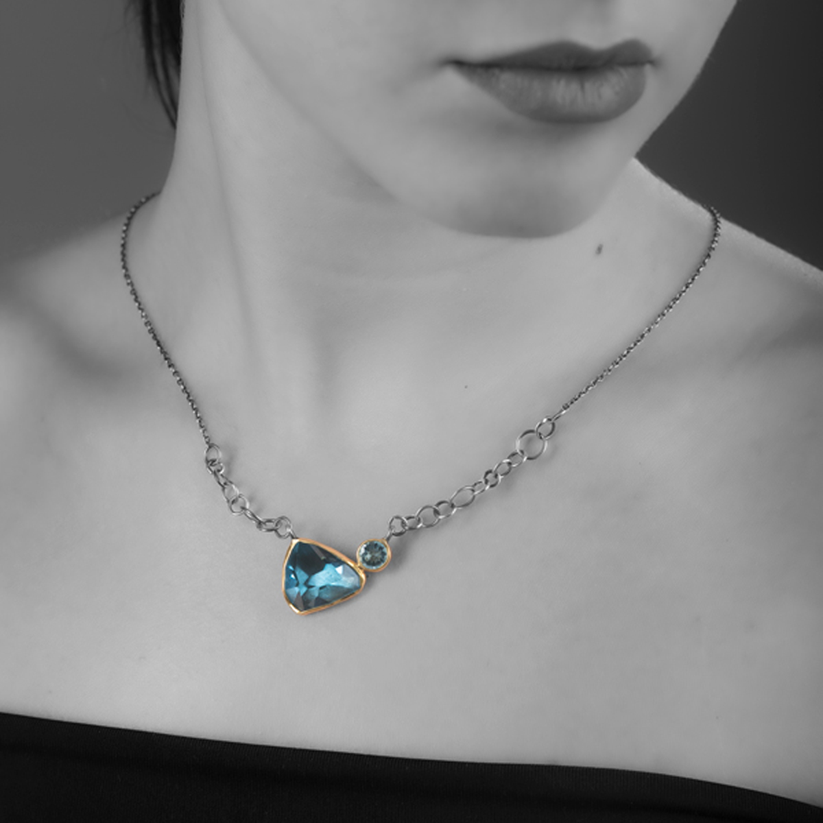 MODEL Aquamarine, Blue Topaz, Gold bezel & oxidized Silver eye necklace